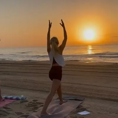 Sunrise beach yoga session on Guardamar del Segura
